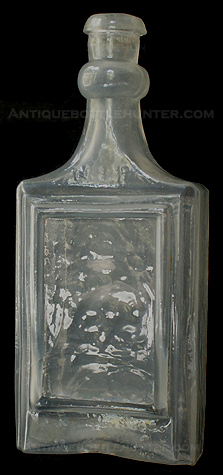 A close-up picture of the N.S.P. cologne. --- AntiqueBottleHunter.com