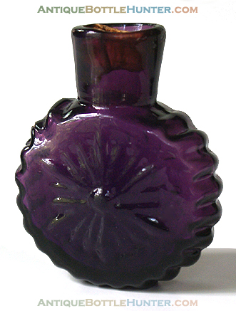 A deep amethyst smelling bottle often called the 'daisy' --- AntiqueBottleHunter.com