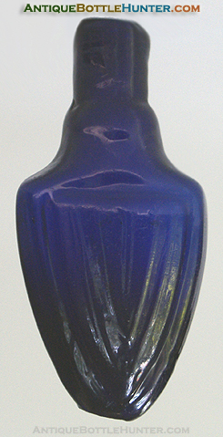 A deep cobalt arrowhead form mold blown smelling bottle. --- AntiqueBottleHunter.com