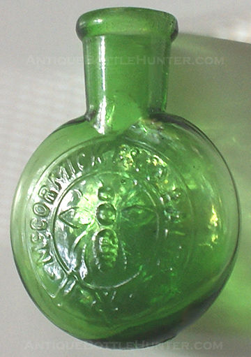 A gradient yellow green McCORMICK & CO. BALTO salts bottle with ground throat. --- AntiqueBottleHunter.com
