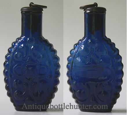 A brilliant blue scent or smelling bottle, with short scroll-ribs and corrugated sides. Similar to McK. plate 104 #7. Height, 2 - 1/2 in. Width, 1 - 1/2 in. --- AntiqueBottleHunter.com
