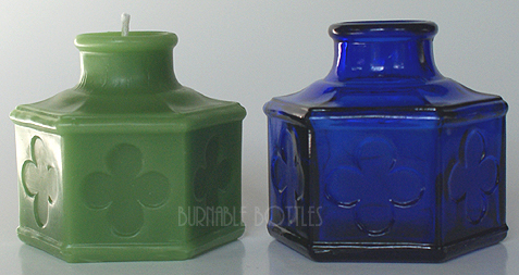 Candle ITEM# 1006 --- A blue CARTER'S (with four leaf clovers) ink bottle and candle. --- Burnable Bottles - AntiqueBottleHunter.com