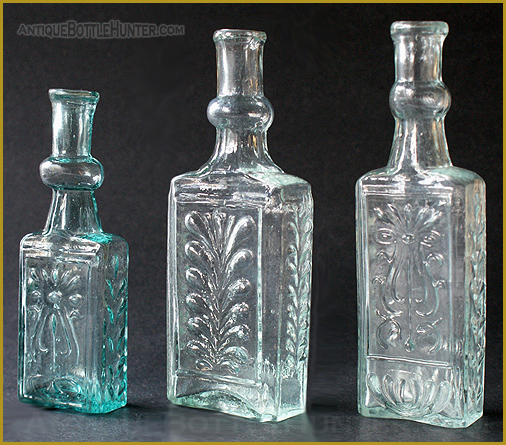 Three colognes with bulbous necks and plumes. The left one is a rich and darker aquamarine. --- AntiqueBottleHunter.com