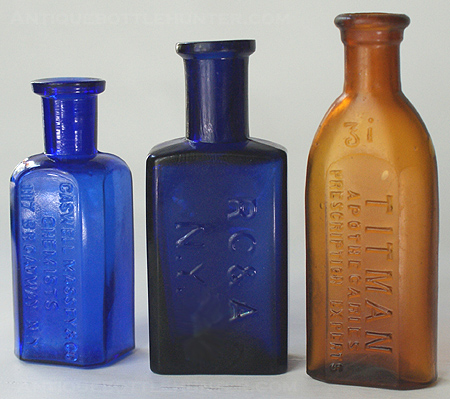 A couple of blue druggists or small medicines: CASWELL MASSEY & CO. / CHEMISTS / 1117 BROADWAY, N.Y. (3 1/4 in.) Then an early R C & A over N.Y. (3 5/8 in.) The last: An amber TITMAN / APOTHECARIES / PRESCRIPTION EXPERTS (3 7/8 in.) --- Antiquebottlehunter.com