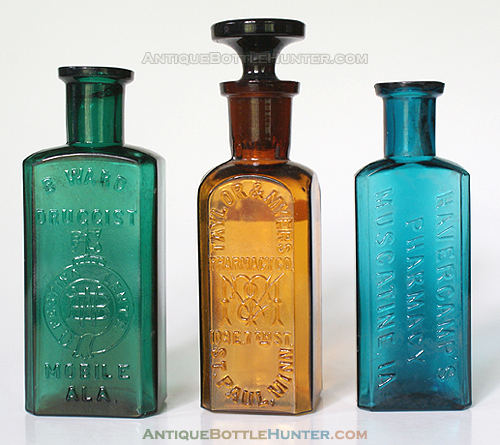 A yellow green B. WARD / DRUGGIST (monogram w/ FESTINA LENTE) / MOBILE ALA., an amber TAYLOR & MYERS / PHARMACY CO. (monogram) / 109 E. 7th ST. / ST. PAUL, MINN. and a bluish teal HAVERCAMP'S / PHARMACY / MUSCATINE, IA (4 1/8 in., 4 3/4 in. w/ stopper, and 4 in.) --- Antiquebottlehunter.com