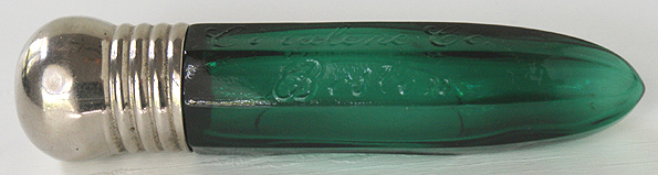 A green eight sided cylinder salts bottle embossed CORALENE CO. / BOSTON in script. Length, 4 - 3/16 in. Width, 15/16 in. --- AntiqueBottleHunter.com