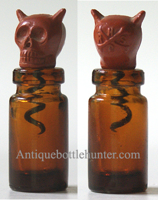 Above is a H R D S (on back) = Hall's Red Devil Skull poison bottle indicator. The smaller of the two sizes; 1 - 1/4 in. with corkscrew. We'd love to add more of these to our collection, if anyone has them to offer... please contact us. --- AntiqueBottleHunter.com 
