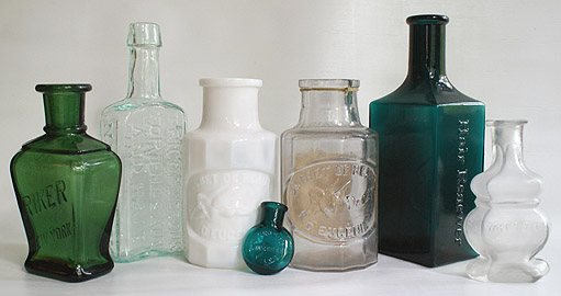 A GROUP OF HAIR AND COSMETIC BOTTLES