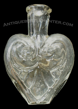 A heart shaped smelling bottle - McK. plate 104 #8. Height, 2 - 3/16 in. --- AntiqueBottleHunter.com