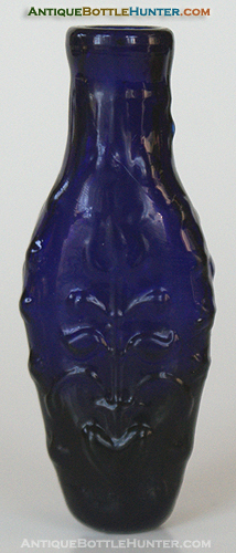 A deep purplish cobalt blue mold blown smelling bottle --- AntiqueBottleHunter.com