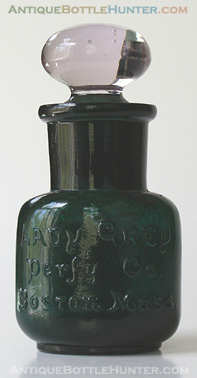 A teal, what we believe is a salts bottle embossed LADY GREY / PERF'Y CO. / BOSTON, MASS. Stoppers for these are usually found in clear/amethyst, as shown. Height, 2 - 5/8 in. not including the stopper. --- AntiqueBottleHunter.com
