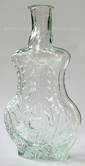 A light aquamarine 'Lyre' cologne. (5 - 3/8 in. tall) --- AntiqueBottleHunter.com