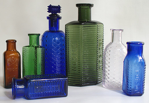 A GROUP OF POISON BOTTLES