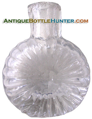 A HVI-2 colorless sunburst scent or smelling bottle, with pontil mark. Height, 1 - 3/4 in. Width, 1 - 3/8 in. --- AntiqueBottleHunter.com