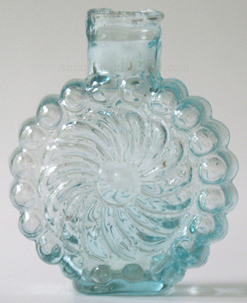 Aquamarine pinwheel scent, similar to a HVI-6 and resembles a McK. plate 104 #3. Height, 2 - 3/16 in. Width, 1 - 3/4 in. --- AntiqueBottleHunter.com