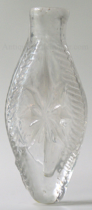 A colorless sunburst smelling bottle or scent. (McK. plate 105 #15 or a HVII-8) Height, 2 - 15/16 in. Width, 1 - 5/16 in. --- AntiqueBottleHunter.com
