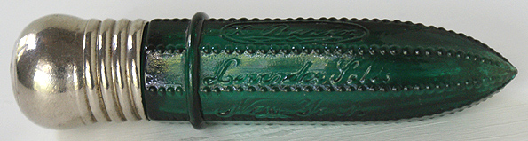 A teal eight sided cylinder salts bottle embossed X. BAZIN in an oval over LAVENDER SALTS over NEW YORK in script. Length, 4 - 1/8 in. Width, 15/16 in. --- AntiqueBottleHunter.com