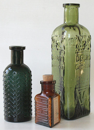 A dark teal KC-1 (4 - 1/2 in.), then an amber KT-5 with label and cork (2 - 1/2 in.) and finally a mossy yellow green KT- 22 (7 in.) --- AntiqueBottleHunter.com